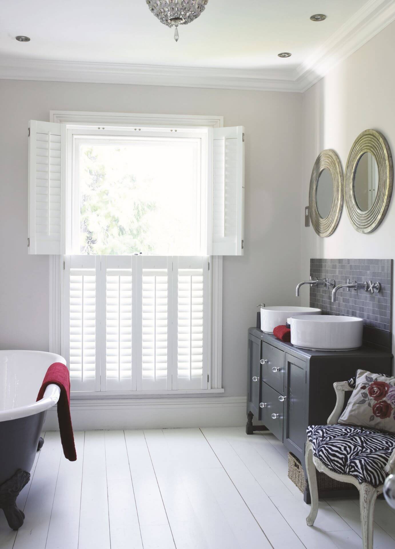 Tier on tier plantation shutters in a sash window